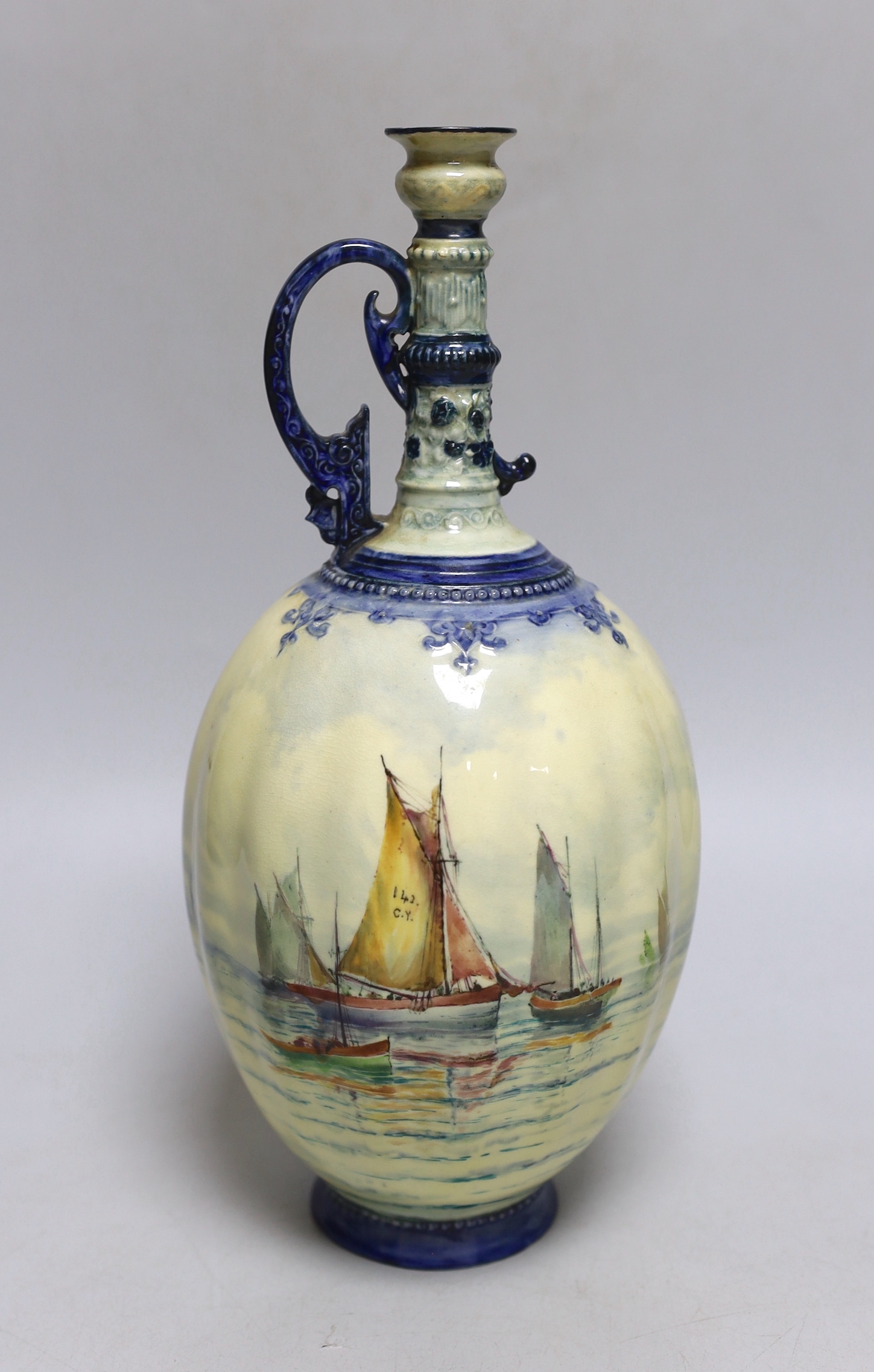 A Royal Crown Derby ewer with a very usual handle, hand painted with a sailing scene with a pale yellow ground by W.E.J. Dean, date mark 1898, 29cm high